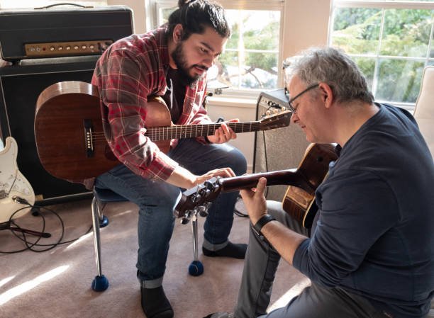 adult taking in-home guitar lesson in Pasadena