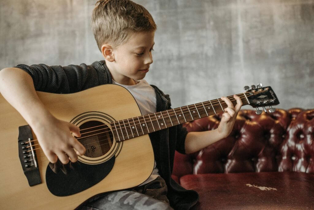 Child practicing piano during in home music lessons in December