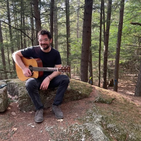 Charlie teaching piano, voice, and guitar lessons to a student during an in home music lesson in Madison, Wisconsinn