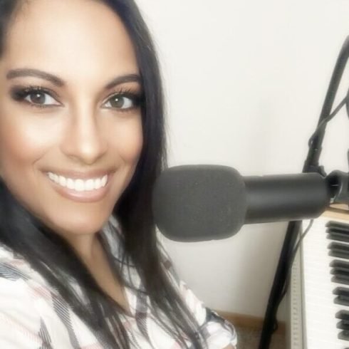 Sairaina teaching piano, voice, and guitar lessons to a student during an in home music lesson in Portland, Oregon